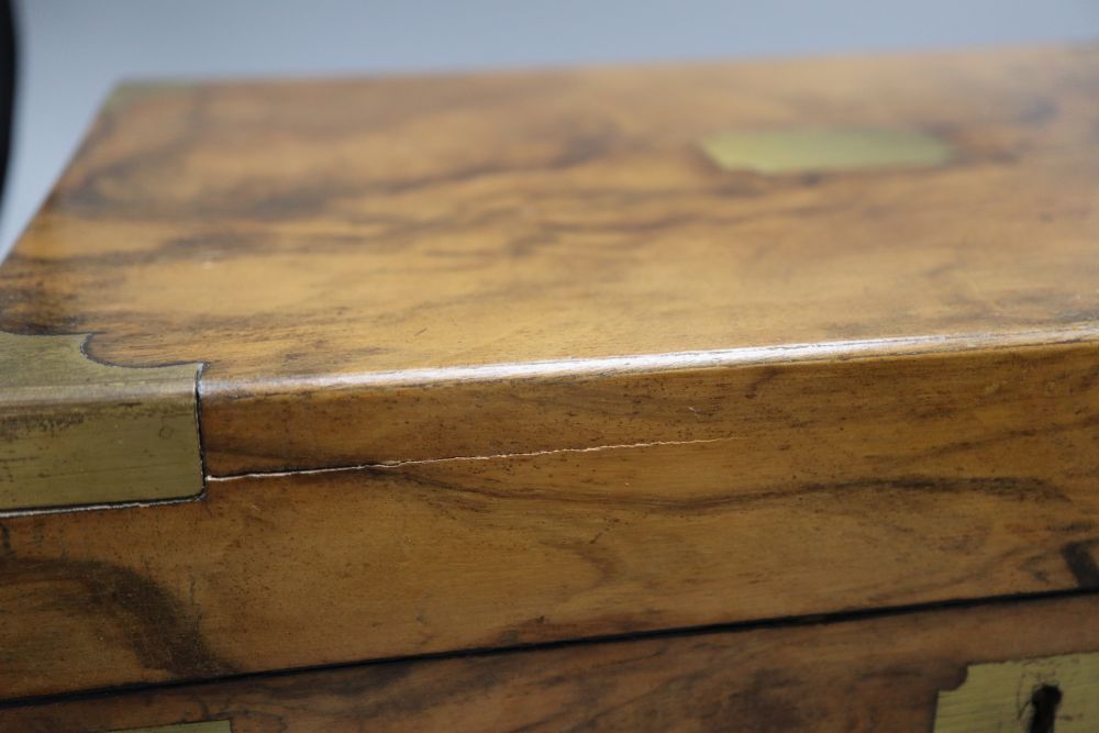 A walnut and brass writing slope with black leather slope, length 35cm